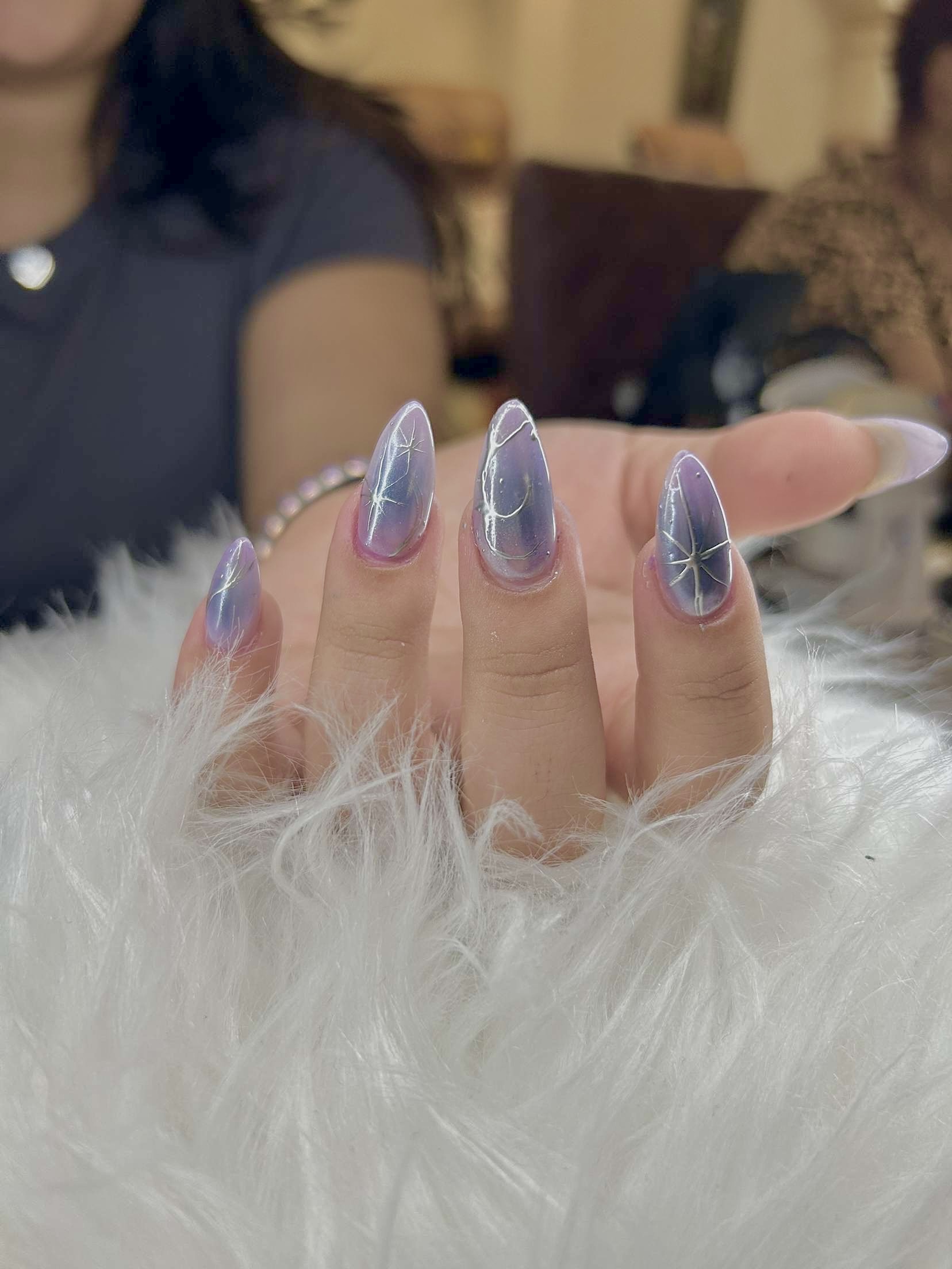 Chrome nails with a soft blue shimmer