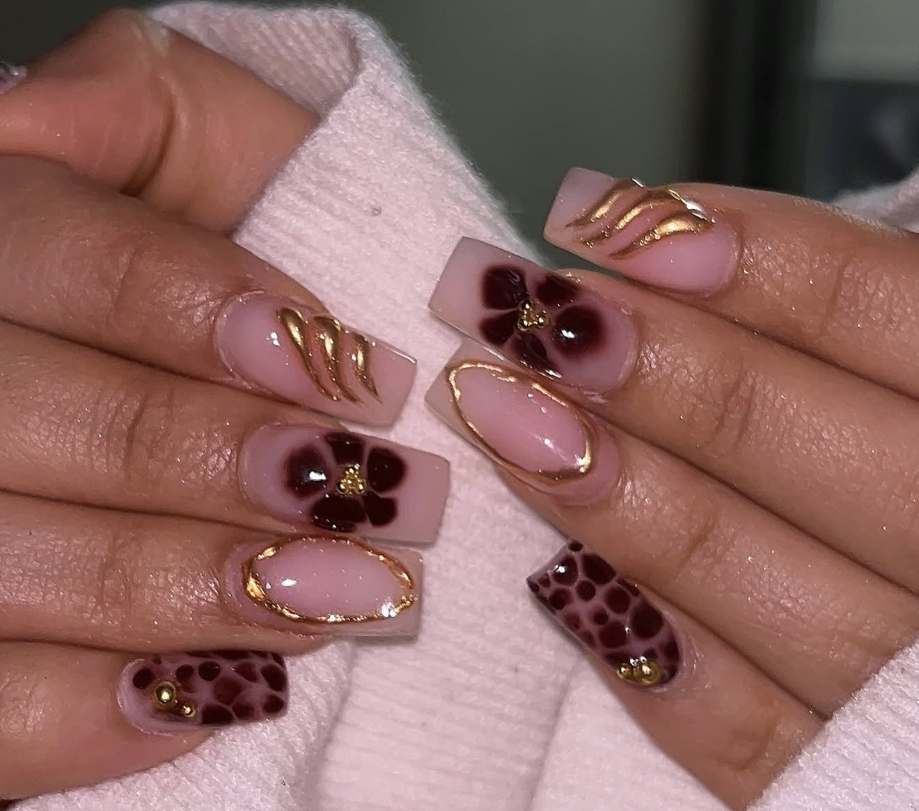 Dark floral nails with gold details